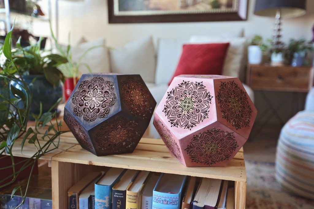 Two Dodecahedron lamps sitting on a coffee table